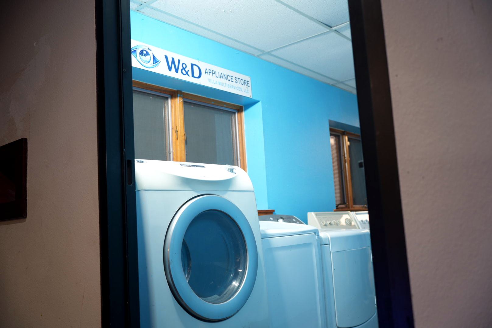 Washers and dryers for sale, seen from our door